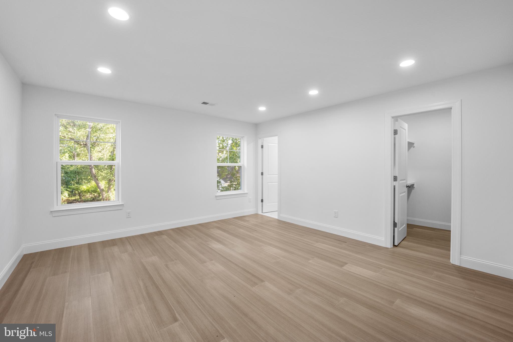 492 Ellis Avenue Lawnside, NJ 08045 - Photo 19 of 33 an empty room with windows and closet