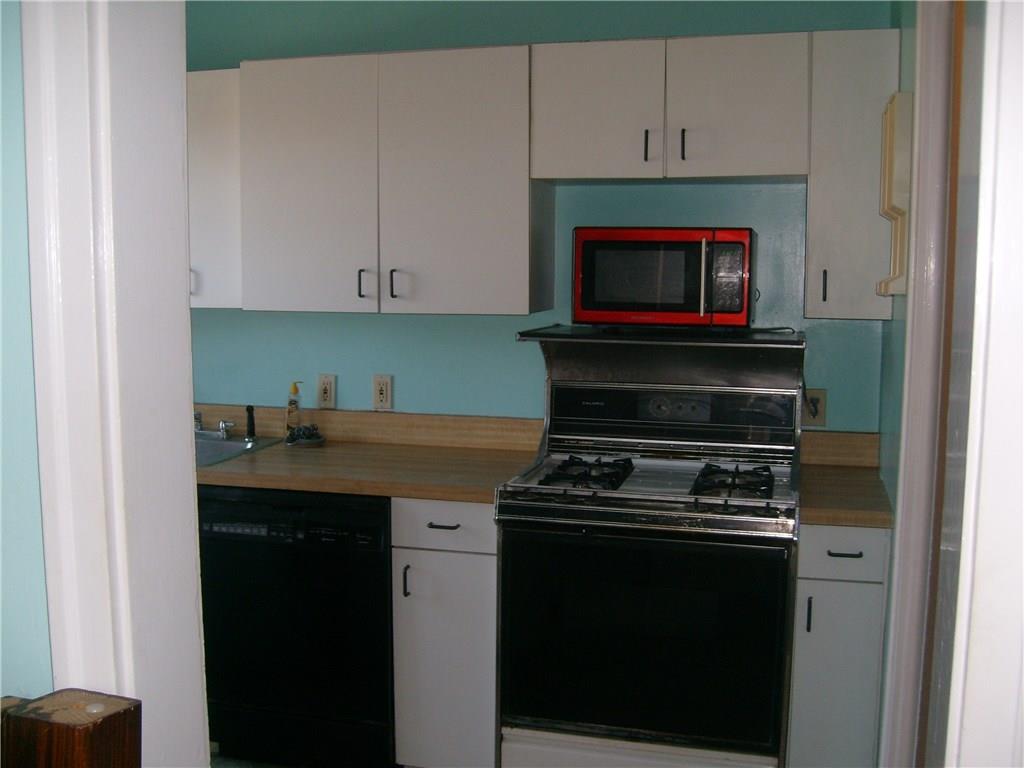 424 Olympia Road Pittsburgh, PA 15211 - Photo 14 of 24 Kitchen with pantry and stairs to lower level.
