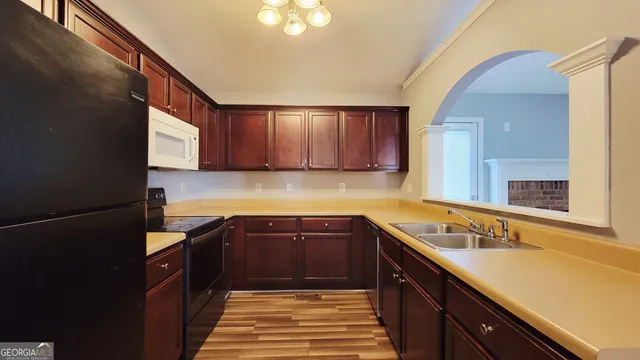 a kitchen with a sink and cabinets