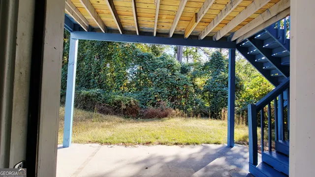 a view of swimming pool with a patio and yard of the house