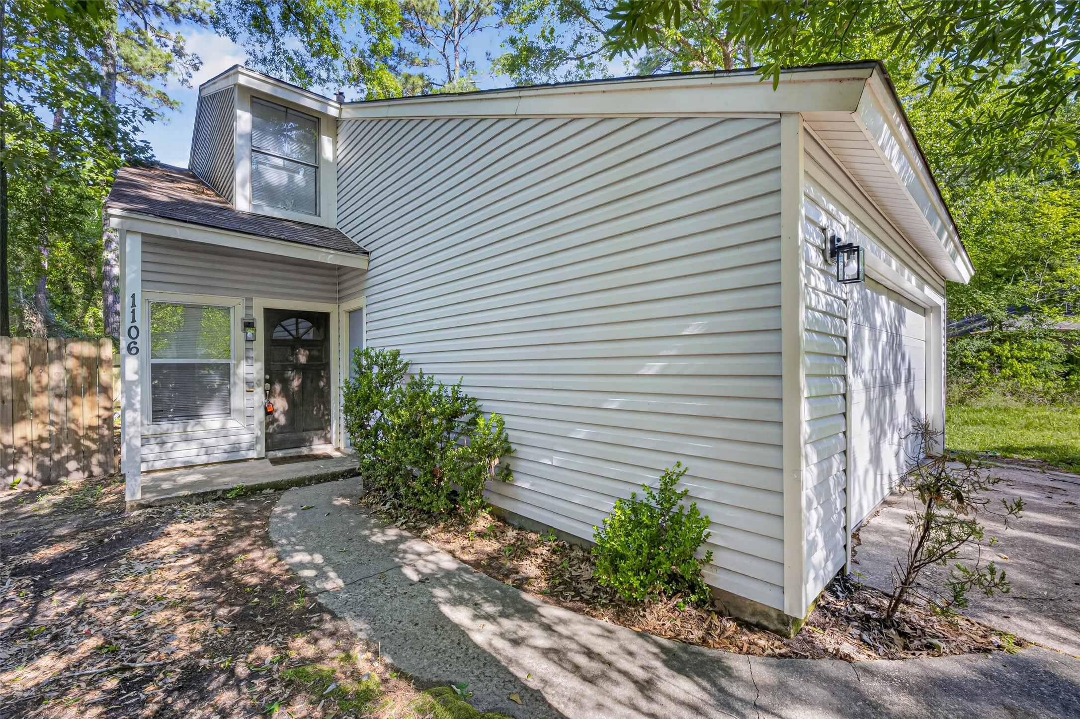 1106 East Red Cedar Circle Spring, TX 77380 - Photo 7 of 43 a view of a house with a yard