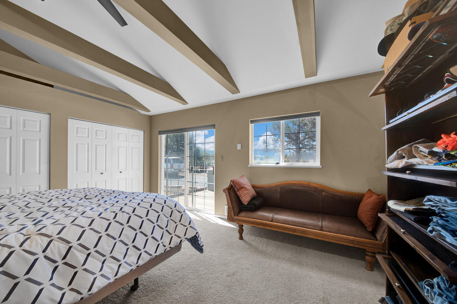 67100 Fryrear Road Bend, OR 97703 - Photo 36 of 38 a bedroom with a bed couch and a window