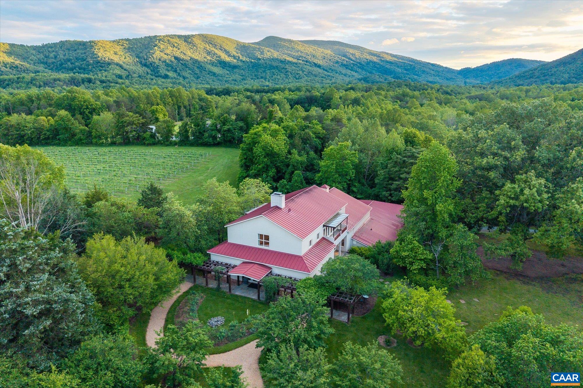 5190 Sugar Ridge Road Crozet, VA 22932 - Photo 50 of 69 a view of a lush green hillside and a houses
