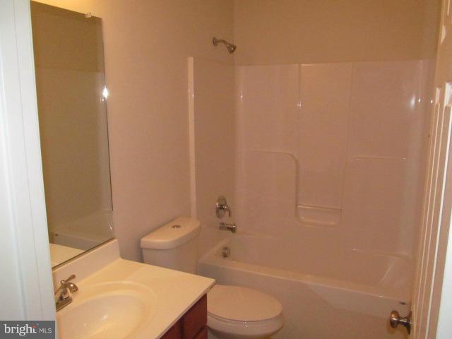 Woodward Lane Rixeyville, VA 22737 - Photo 11 of 19 a bathroom with a toilet a sink and shower