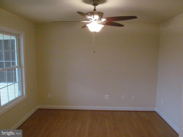 Woodward Lane Rixeyville, VA 22737 - Photo 6 of 19 en empty room with windows and ceiling fan