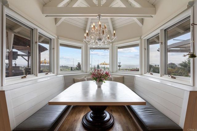 a living room with furniture a fireplace and a table