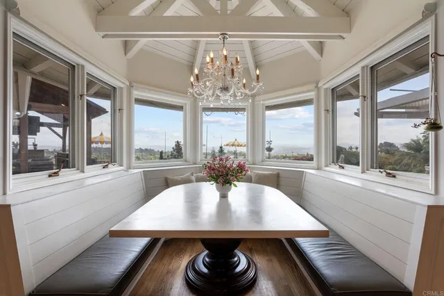 a living room with furniture a fireplace and a table
