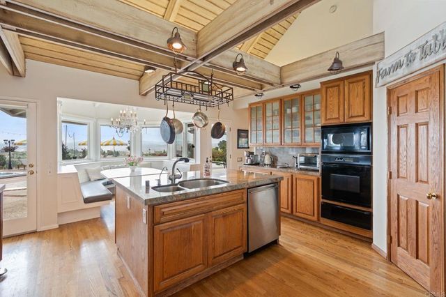 a bedroom with bed and glass door
