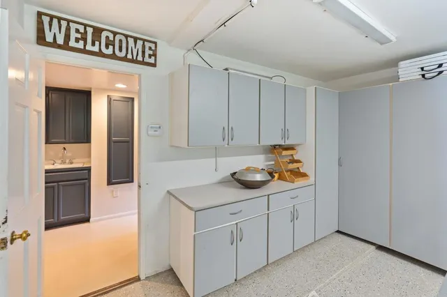 a living room with furniture a fireplace and wooden floor