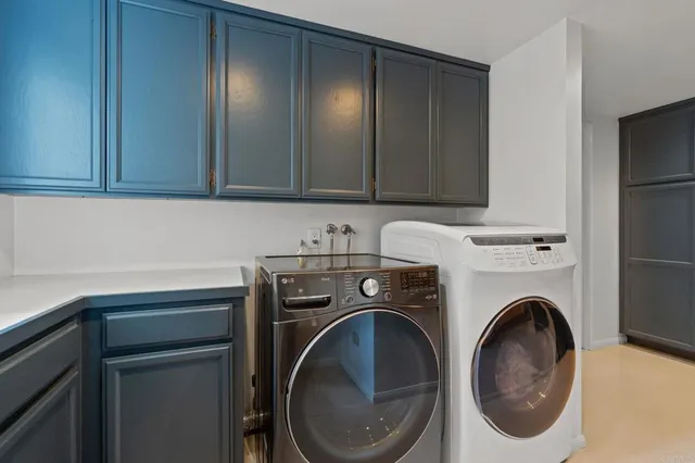 a bathroom with a granite countertop sink a mirror a vanity and shower