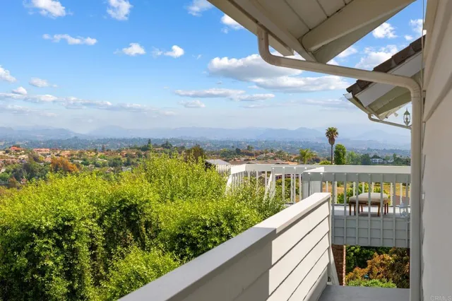 a bedroom with a bed and a mirror