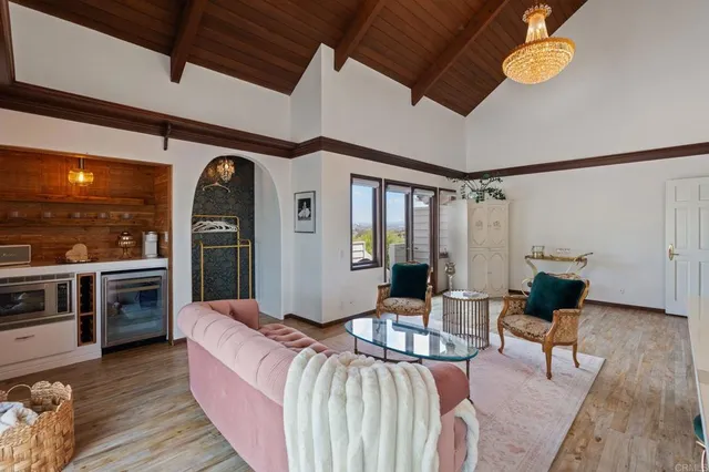 a bedroom with a large bed and a dresser