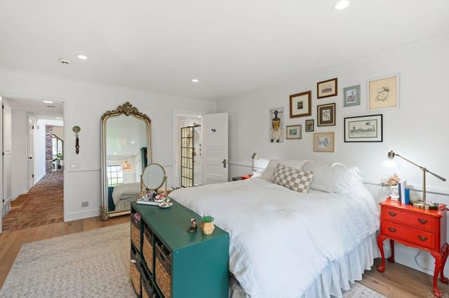 a kitchen with stainless steel appliances granite countertop a sink a stove and a wooden floors