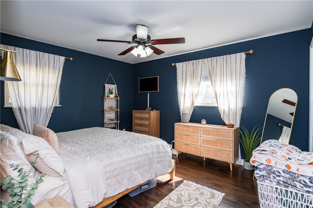4102 Ridgetop Drive Bellbrook, OH 45305 - Photo 15 of 33 This serene bedroom offers ample light and comfort with beautiful hardwood flooring.