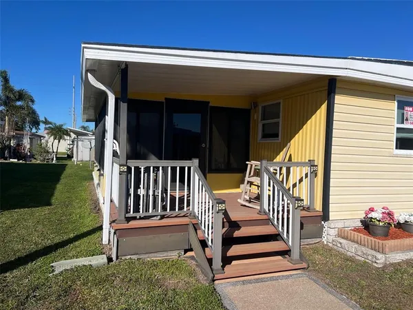 a view of two chairs in the balcony