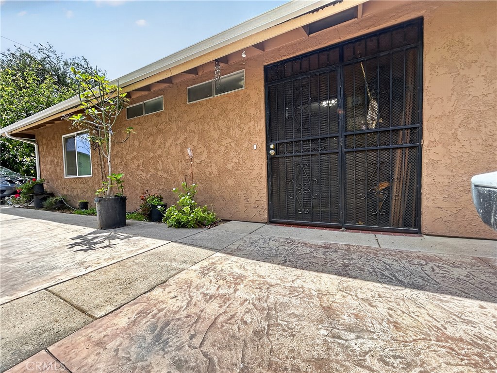 7451 Diamond Street Riverside, CA 92504 - Photo 24 of 31 a front view of a house with a yard and garage