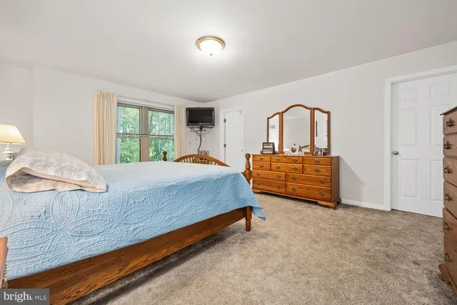 a bathroom with a sink vanity and mirror
