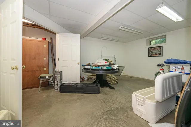 a view of yard with seating area and trees around