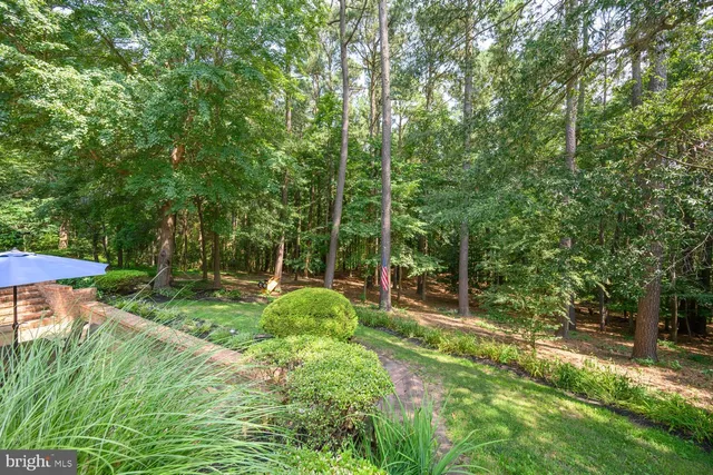 a view of a table and chairs under an umbrella