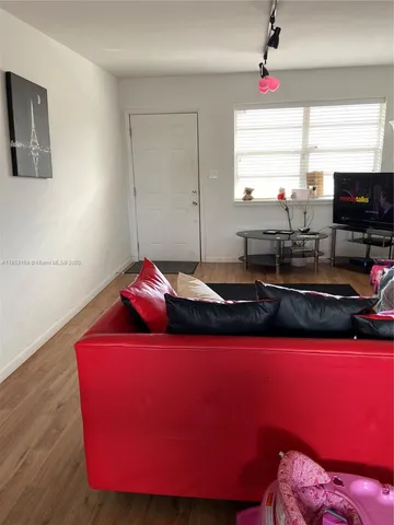 a kitchen with stainless steel appliances a refrigerator stove and microwave