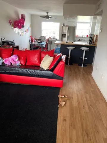 a bathroom with a toilet bathtub and window