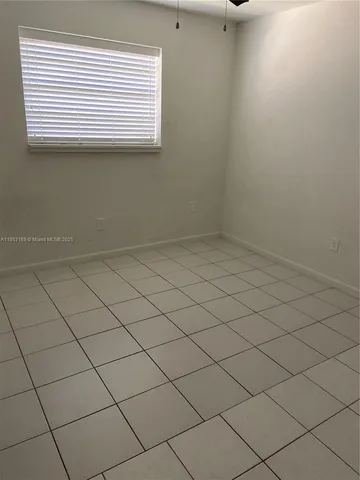 a white toilet sitting next to a bath tub
