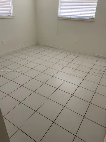 a close view of appliances and cabinets in the kitchen