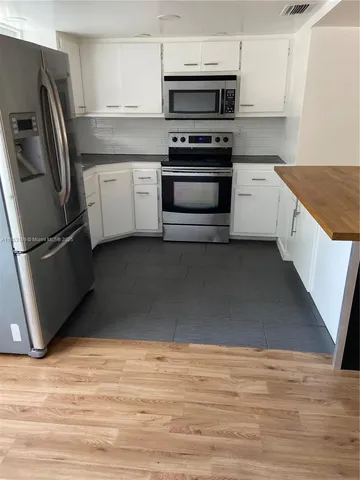 a bathroom with a sink toilet and vanity