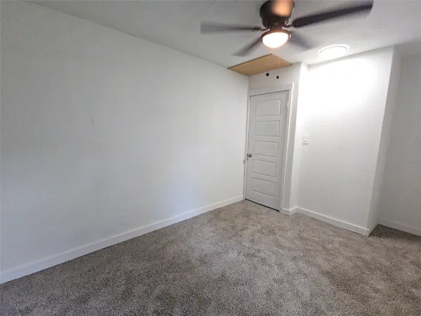 a kitchen with stainless steel appliances a stove a microwave and a hard wood floor