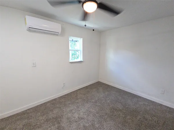a kitchen with a refrigerator and stove