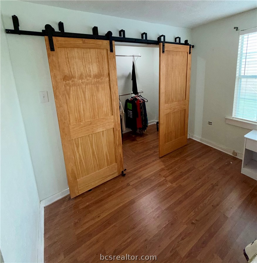 421 South Commerce Street Centerville, TX 75833 - Photo 11 of 23 an entryway with wooden floor
