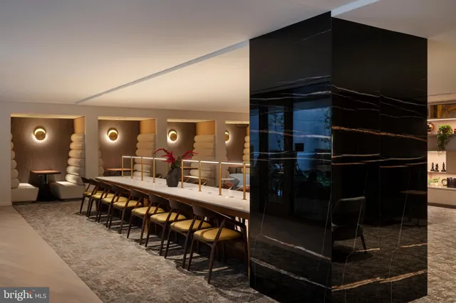 a large kitchen with a table and chairs