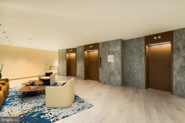 a outdoor dining space with furniture and city view