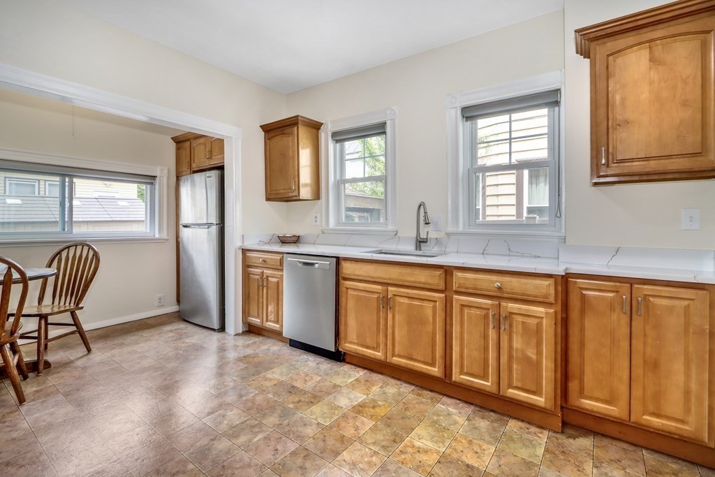 24 Baker Road Everett, MA 02149 - Photo 12 of 26 a spacious bathroom with a granite countertop sink and a bathtub