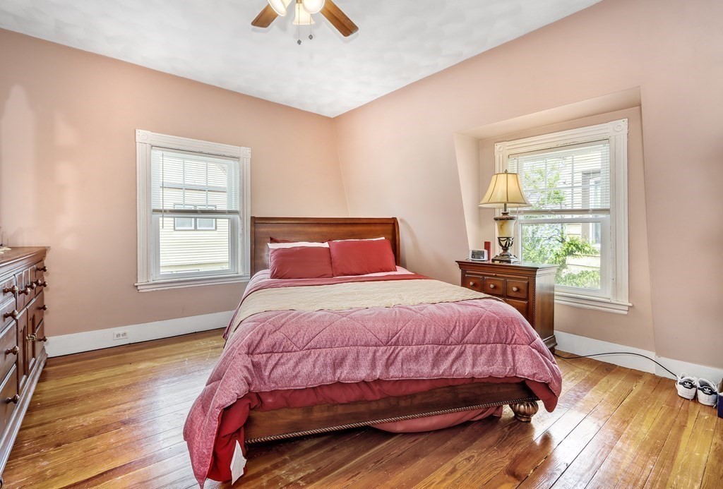 24 Baker Road Everett, MA 02149 - Photo 13 of 26 a bedroom with a bed and a window