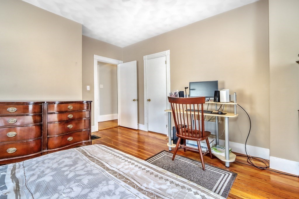 24 Baker Road Everett, MA 02149 - Photo 16 of 26 a bedroom with furniture and wooden floor