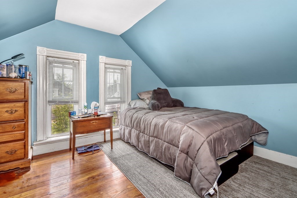 24 Baker Road Everett, MA 02149 - Photo 23 of 26 a bedroom with a bed and a window
