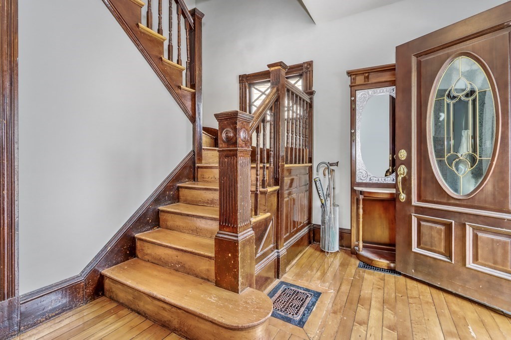 24 Baker Road Everett, MA 02149 - Photo 4 of 26 a view of an entryway with wooden floor and front door