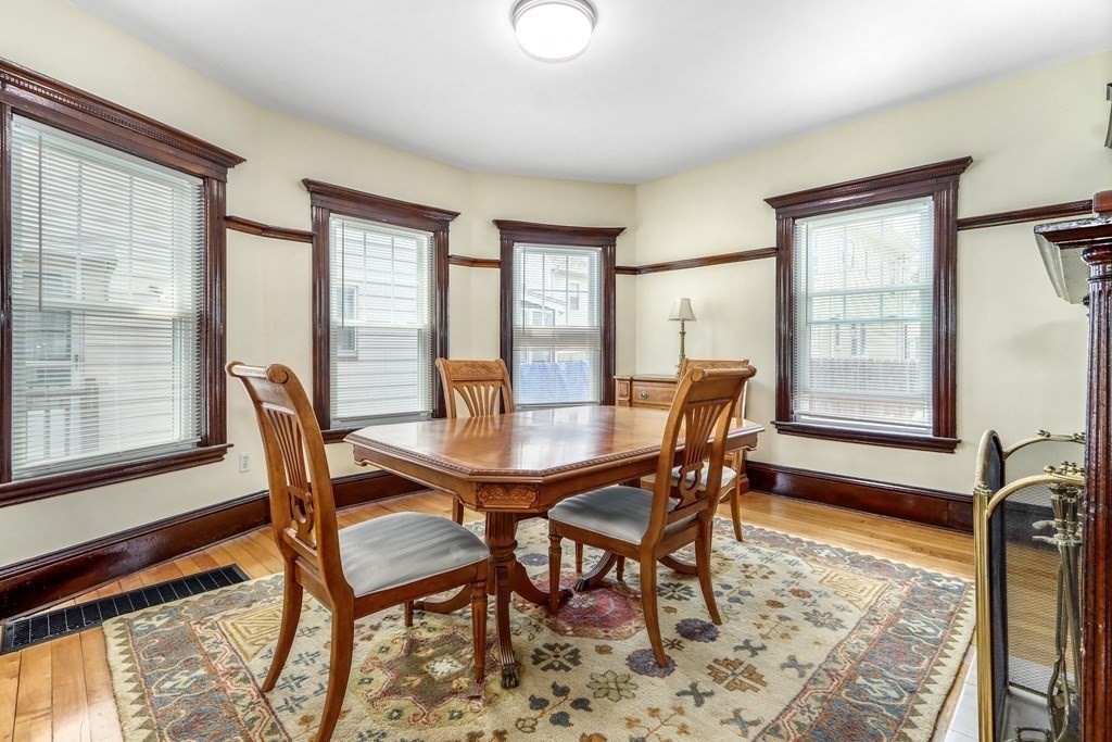 24 Baker Road Everett, MA 02149 - Photo 9 of 26 a dining room with furniture and wooden floor