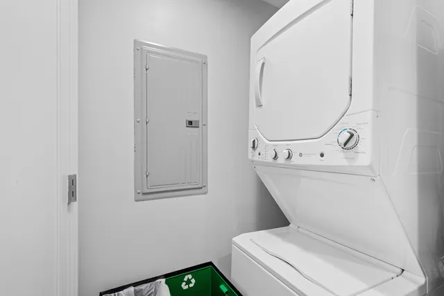 a bathroom with a toilet and a mirror