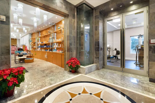 a large kitchen with a table and chairs in it