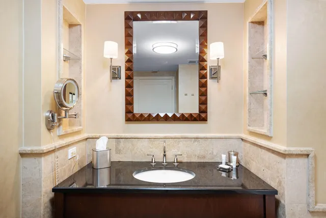 a bathroom with a sink and a mirror