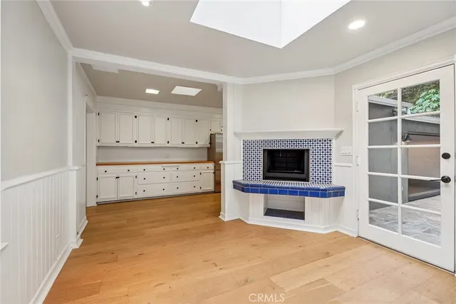a view of a room with cabinet and a flat screen tv