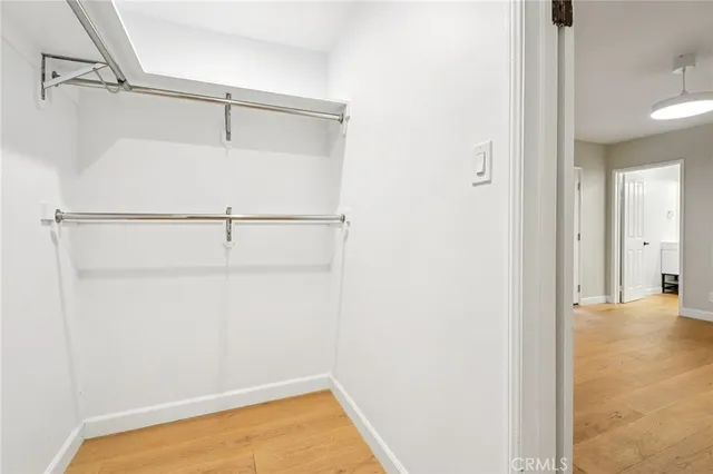 a bathroom with a toilet a sink and a mirror