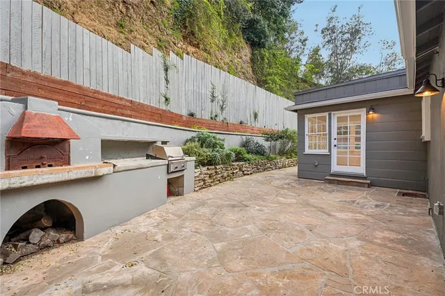 a view of a house with a backyard and a garage