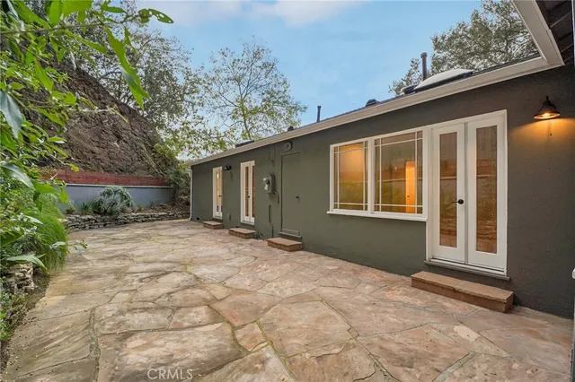 a view of a house with a tree