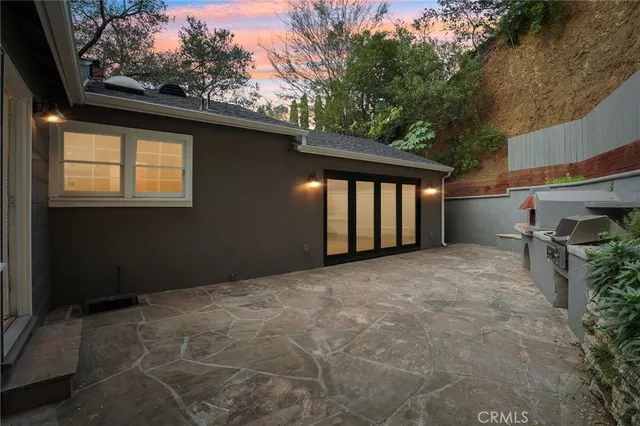 a view of backyard and a tree