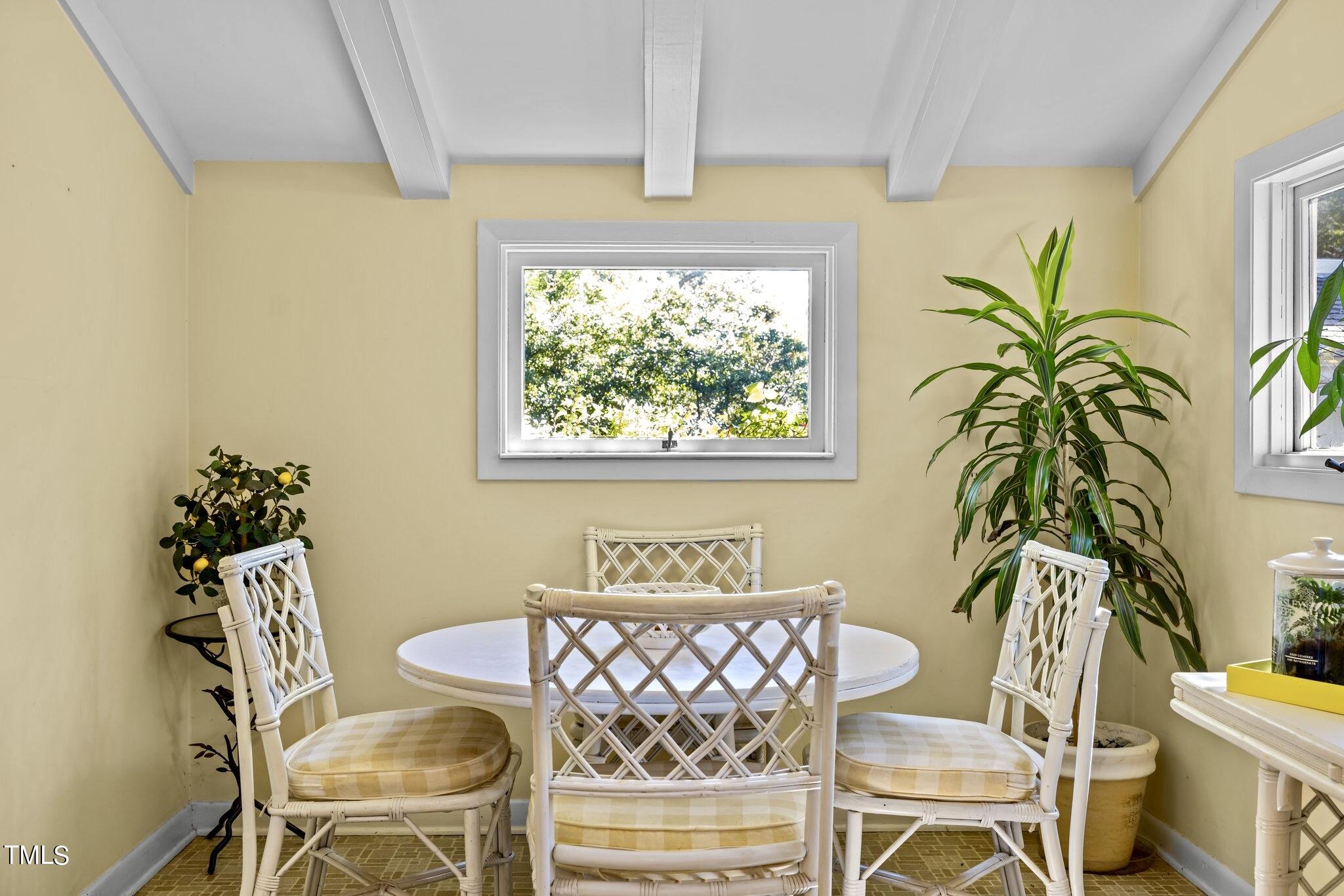 1510 Ridge Road Raleigh, NC 27607 - Photo 25 of 55 a view of a dining room with furniture and a potted plant