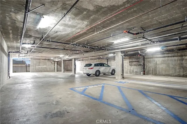a view of parking garage with cars
