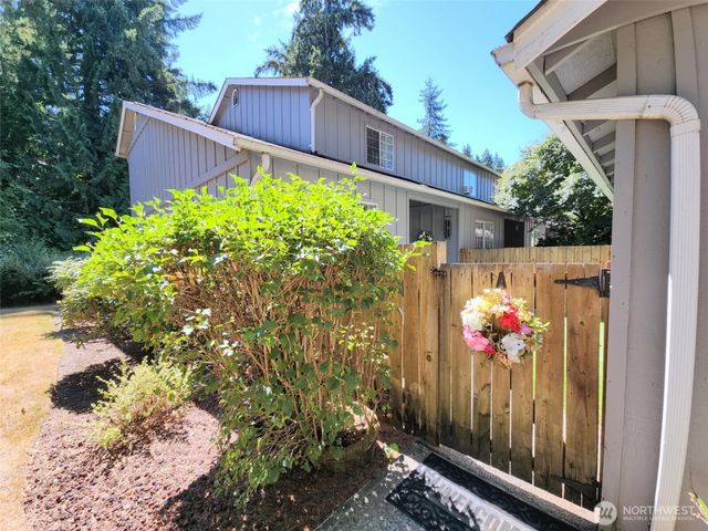 a view of a backyard with flowers